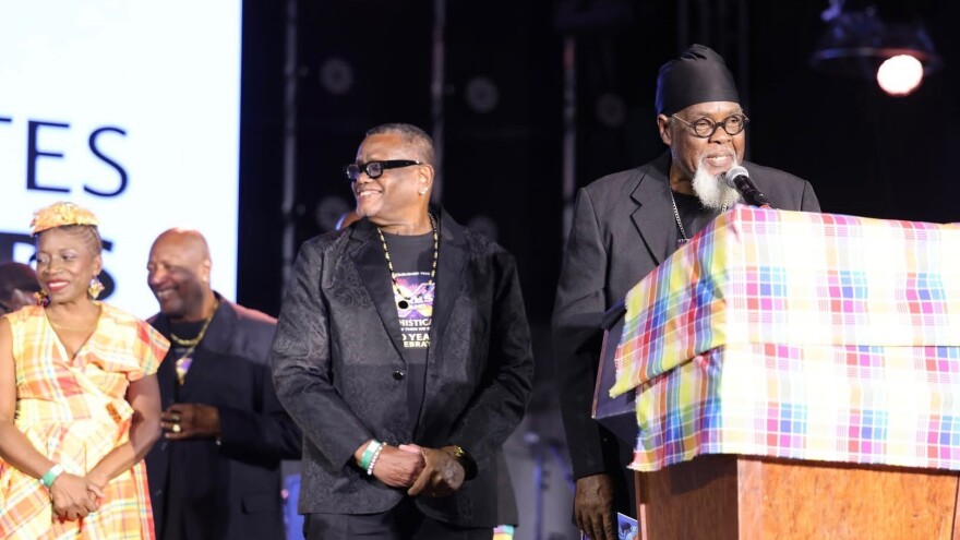 Pictured: Dean Baptiste, vocals and bass for the world-famous Xpress Band, speaks during the opening of Festival Village as the legendary group was honored as the 2025–2026 Crucian Christmas Festival Village honorees at Xpress’s Famous Sound Stadium in Frederiksted.
