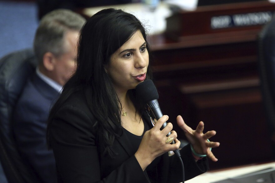FILE: Rep. Anna Eskamani, D-Orlando, speaks about an environmental water bill during session Wednesday March 11, 2020 in Tallahassee, Fla. (AP Photo/Steve Cannon)