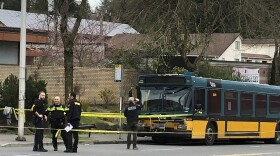  Investigators work on the scene of the shooting in Seattle on Wednesday, March 27, 2019.