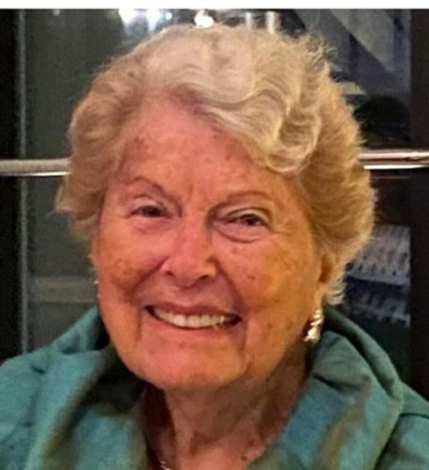 Photo of Charlotte "Chuckie" Holstein smiling and wearing a blue jacket.