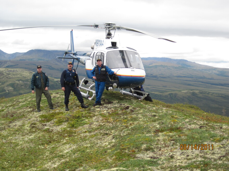 (From left) Alaska State Trooper pilot Mel Nading, trooper David Russel and Clint Johnson on Aug. 14, 2011, near McGrath, Alaska. Nading was killed in a helicopter accident shortly after the photo was taken.