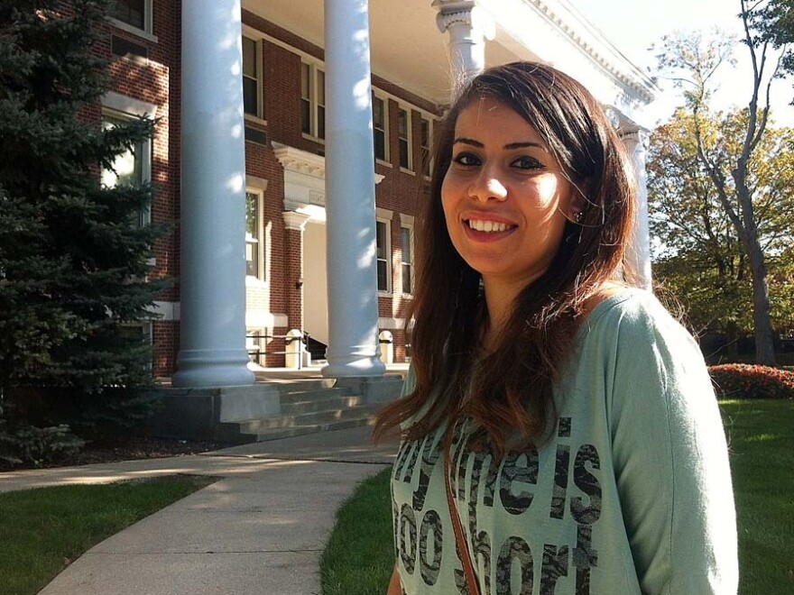 Fida'a Abuassi outside Good Hall on the University of Indianapolis campus. She arrived two months late for her graduate program after being stuck in the Gaza Strip, but got her student ID and started classes Wednesday.