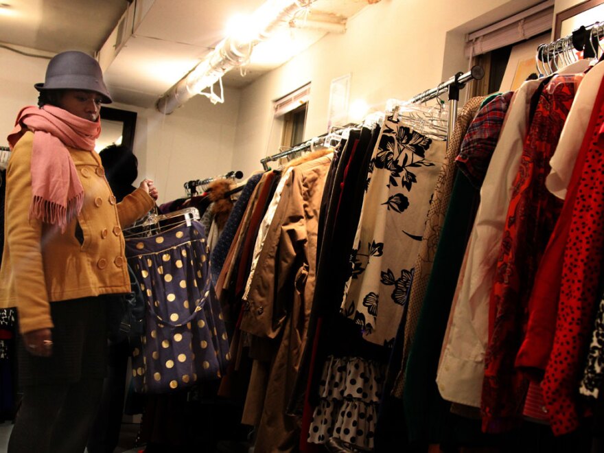 Portia Obeng searches the racks of Goodwill clothes at the trunk show at Caramel.