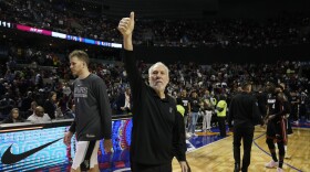 San Antonio Spurs head coach Gregg Popovich flashes a thumb up after losing to the Miami Heat at the end of an NBA basketball game, at the Mexico Arena in Mexico City, Saturday, Dec. 17, 2022.