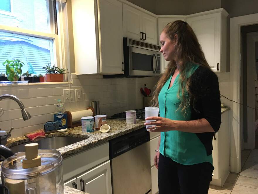 Amanda Moller prepares her formula in her home in University City, Missouri. The formula is vital to treat a rare condition, but her insurer doesn't cover it.