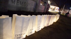 Organizers lit candles in paper bags with the names of those who died for reasons related to homelessness.