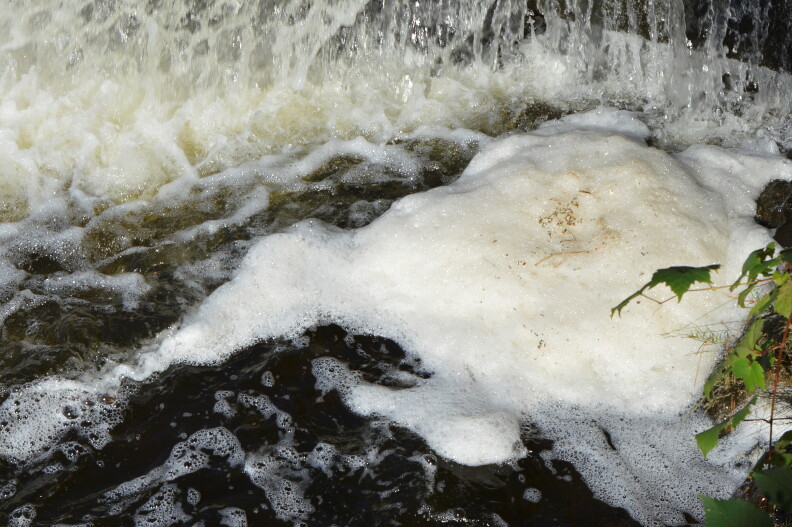 Foam caused by PFAS contamination at one of the many sites in the state where the "forever" chemicals have been found.