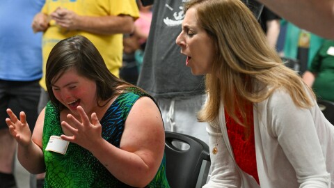 Amanda, who plays an Ariel in the show, sings with Director Geri Featherby.