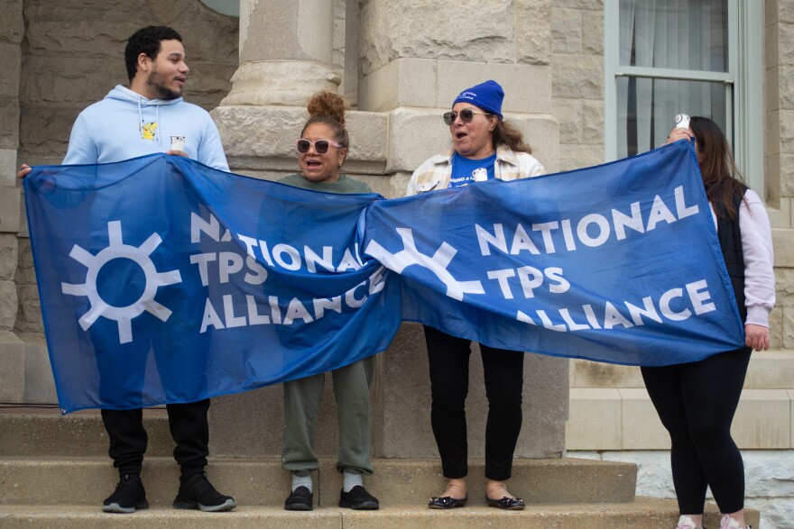 Supporters carried flags from the National TPS Alliance, an advocacy group formed by TPS beneficiaries from across the country.