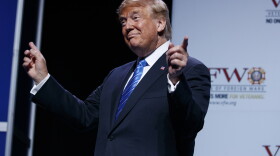 President Donald Trump gestures to music as he arrives to speak to the national convention of the Veterans of Foreign Wars, Tuesday, July 24, 2018, in Kansas City, Mo.
