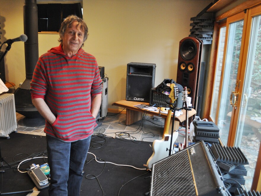 The Waitresses' founder and songwriter, Chris Butler, at his Akron house, with vintage Vox amplifier.