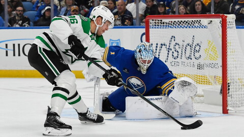 Dallas Stars right wing Mikko Rantanen, left, skates the puck in against Buffalo Sabres goalie Ukko-Pekka Luukkonen, right, during the second period of an NHL hockey game Thursday, Oct. 8, 2026, in Buffalo, N.Y. (AP Photo/Adrian Kraus)