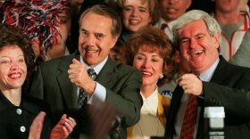 Republican presidential hopeful Sen. Bob Dole, joined by his daughter Robin, left, his wife Elizabeth and then-House Speaker Newt Gingrich of Georgia, right, attends a rally on Tuesday, March 12, 1996 in Washington. 