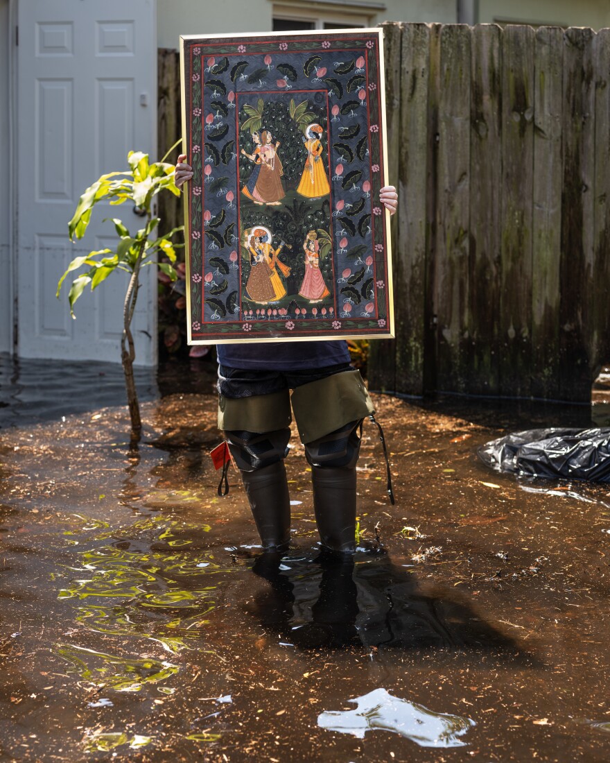  Jody Berman holds up one of the only possessions she was able to salvage from the flooding: A family heirloom Indian painting that belonged to her grandmother. "Everything, like literally everything is destroyed in my house," she said.