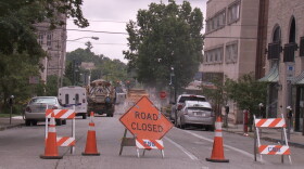 Crews work on the road at Kirkwood and Washington after a water main break caused flooding in July of 2019.