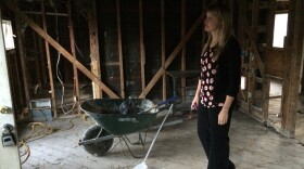 Lindsay Langdale surveys the stripped-down lumber supporting her house after required mold remediation had been done. 