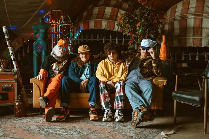 The Iceman Special sitting together on a couch 