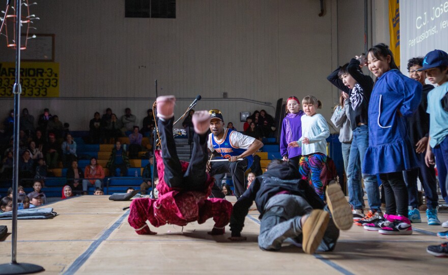 Audience members join drummer C.J. Joseph on the Cama'i stage on March 29, 2026 in Bethel, Alaska.