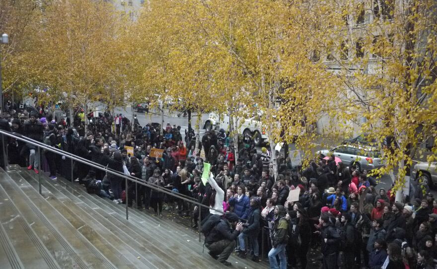 Demonstrators arrive at the Federal Courthouse in downtown Seattle