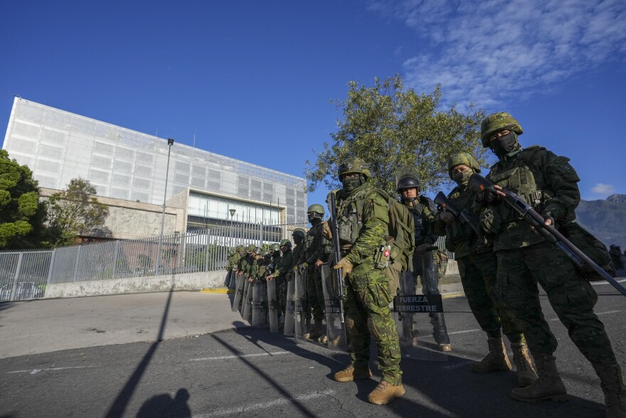 Soldiers guard the National Assembly in Quito, Ecuador, Wednesday, May 17, 2023.