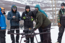 Alaska’s Department of Transportation avalanche mitigation team prepares a drone from Drone Amplified for deployment in the backcountry.