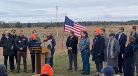 Governor Maura Healey (at the podium) announced that alpha-gal syndrome will become a reportable condition in Massachusetts at the Frances A. Crane Wildlife Management Area in North Falmouth. Massachusetts Public Health Commissioner Dr. Robbie Goldstein (leftmost person standing) spoke about the importance of collecting data on the emerging condition.