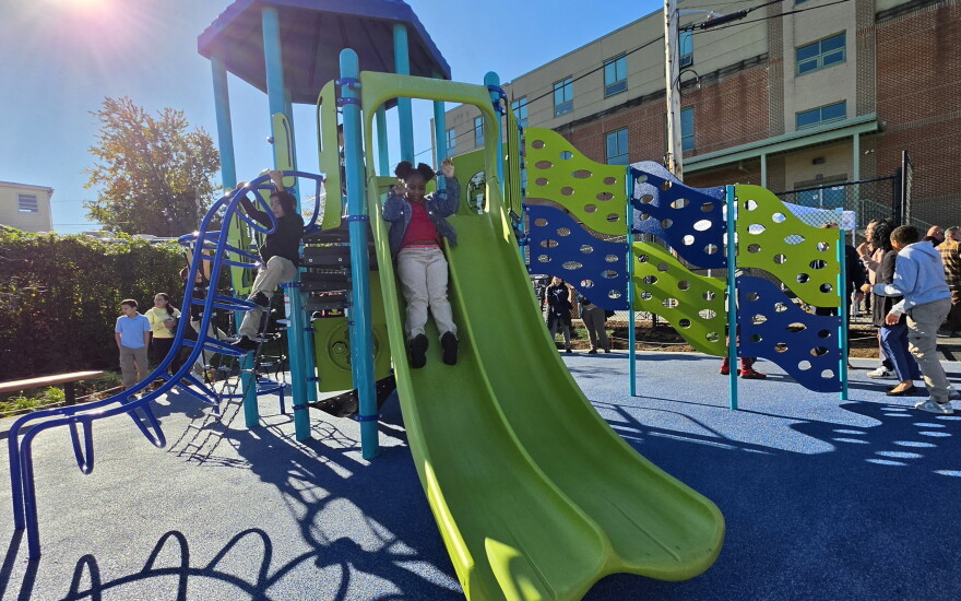 Students explore the playground they helped design at Whittier Elementary in South Scranton.