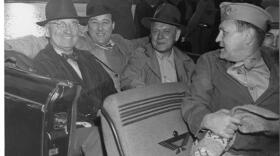 President Harry S. Truman goes for a car ride during a Puget Sound fishing trip. From left to right, Truman, Sen. Warren G. Magnuson, Gov. Monrad C. Wallgren, and Maj. Gen. Harry H. Vaughan.