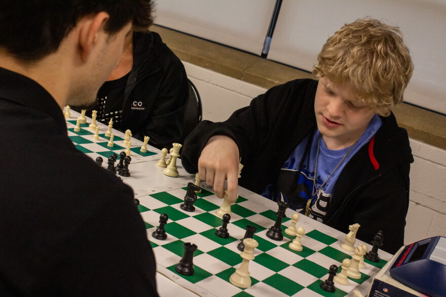 Gavin Hannah plays a practice chess game in preparation for a tournament during a Masters and Mentors class.