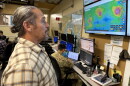 David Lopez, administrator of the Hawaiʻi Emergency Management Agency, looks at screens inside agency headquarters in Honolulu on Thursday, Sept. 3, 2026.