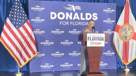 Man speaking at a podium