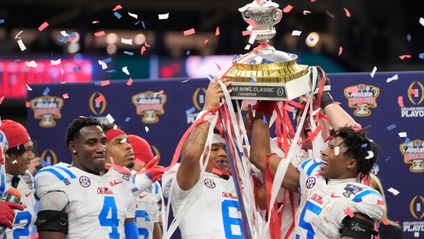 Mississippi platers and coach celebrate a win against Georgia after the Sugar Bowl NCAA college football playoff quarterfinal game, Friday, Jan. 2, 2026, in New Orleans. (AP Photo/Gerald Herbert)