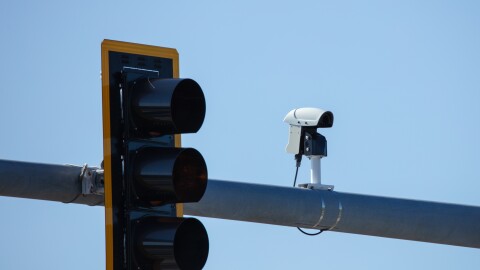 Image of a traffic camera at a red light watching roadway