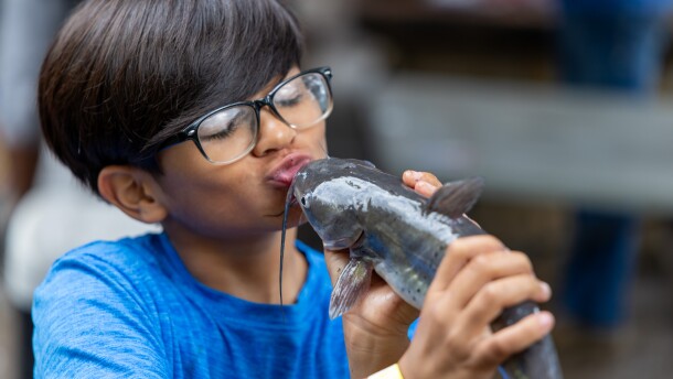 Young boy with his catfish catch at a fall fishing event at the park last year
