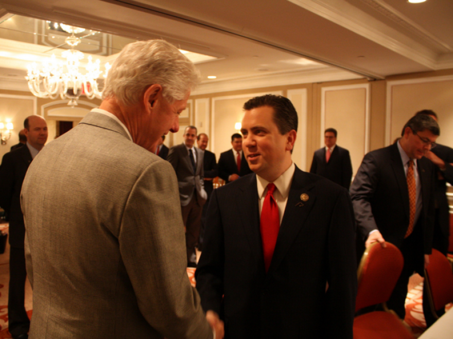 Then-U.S. Rep. Dan Boren talking with former President Bill Clinton during a 2011 meeting of the Blue Dog Coalition of conservative Democrats in New York.