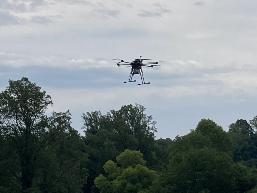 A drone equipped by NASA rises over UVA's Morven Farm.