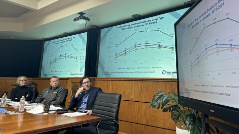 Dr. Arwen Podesta (left), Pineville Mayor Joseph Bishop (center) and Dr. Peter Croughan (right), of Louisiana’s Opioid Abatement Task Force, view data from the Louisiana Opioid Surveillance Program in Baton Rouge, Louisiana, on Wednesday, December 3, 2025. The state saw a 31% decrease in drug-involved overdose deaths from 2023 to 2024.