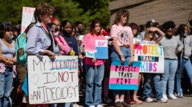 Students walk out of Richmond’s Open High School in September 2022 to protest Gov. Glenn Youngkin’s proposed policies for the treatment of transgender students. (Crixell Matthews/VPM News File)