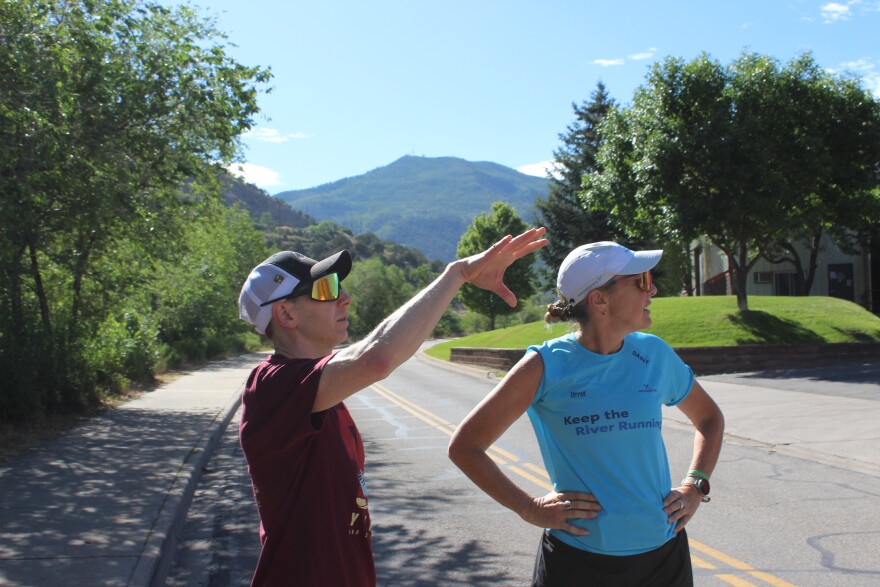 Brian Burkhardt (left) speaks to water advocate Mina Guli during a break in a run along Colorado River in Glenwood Springs on June 27, 2026.