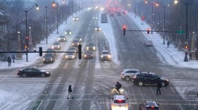 Pedestrians navigate slippery streets in Chicago. (Charles Rex Arbogast/AP)