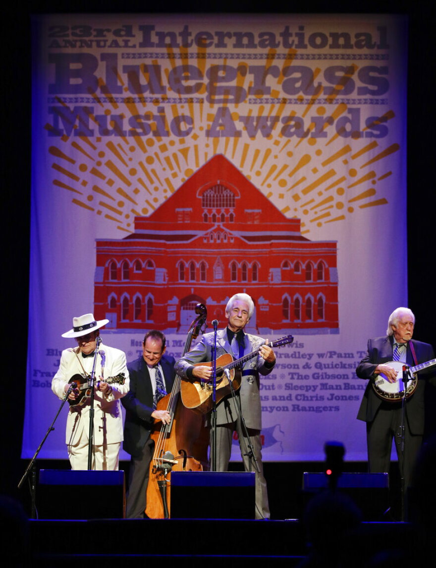 FILE - Del McCoury, center; Bobby Osborne, left; and J. D. Crowe, right; perform at the International Bluegrass Music Association Awards show on Thursday, Sept. 27, 2012, in Nashville, Tenn. Influential Bluegrass musician J.D. Crowe died early Friday, Dec. 24, 2021 his family announced on social media. The Lexington, Kentucky, native was 84. No cause of death was given.(AP Photo/Mark Humphrey, File)