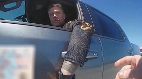 In this screengrab made from body camera footage provided by the Monroe County, Fla., Sheriff's Office, off-duty U.S. Immigration and Customs Enforcement agent Scott Deiseroth argues with a deputy who pulled him over for drunk driving with his children in the car in August 2025. (Monroe County Sheriff's Office via AP)