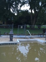 DeeDee Brickner recently upgraded the pool liner at this one-story ranch she owns and rents to tenants. With this latest flood, she's ready to hand over the keys to the city.