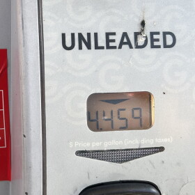Signs on gas pumps at Giant Eagle on North High Street in Clintonville list federal and state gas taxes.