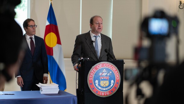 Colorado Gov. Jared Polis speaks to reporters as he calls a special legislative session to address a nearly $1 billion budget deficit during a news conference at the governor's mansion in downtown Denver on Wednesday, Aug. 6, 2025. (Jesse Paul, The Colorado Sun)