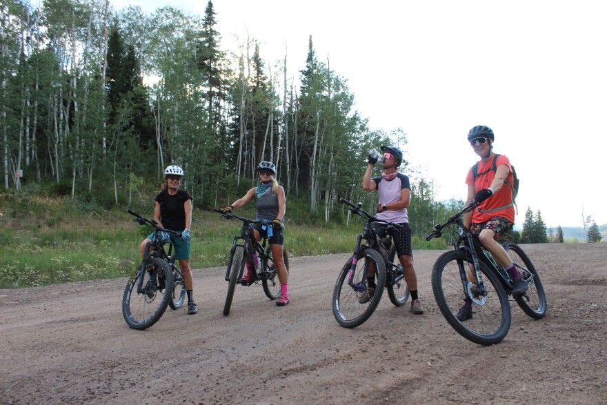 Members of the Girls Outside mountain biking group take a quick break during a ride on the Expresso trail near Snowmass Village on Aug. 4, 2026.