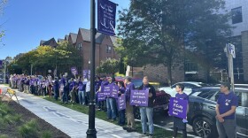 Members of the University of Scranton faculty, who have continued to work since their contract expired Sept. 1, protested the opening of the new Weiss Hall last month.