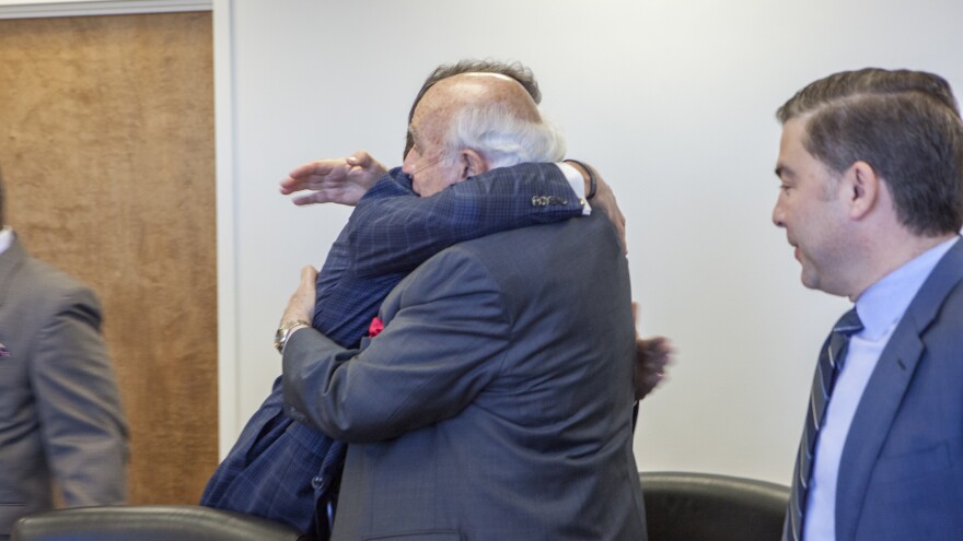 Another photo obtained by The Associated Press shows Robert Murray (right) hugging Perry at the Department of Energy headquarters.