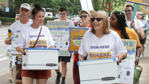 Eugene Clean Energy Fund supporters march through downtown Eugene.