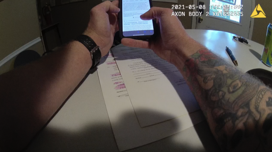 A screenshot from then-Kincaid Police Officer Sean Grayson's bodycam showing him Googling various Illinois criminal laws about drugs as he decides what charges to bring against Kyle Adkins — which he admits shortly after he has no evidence for.